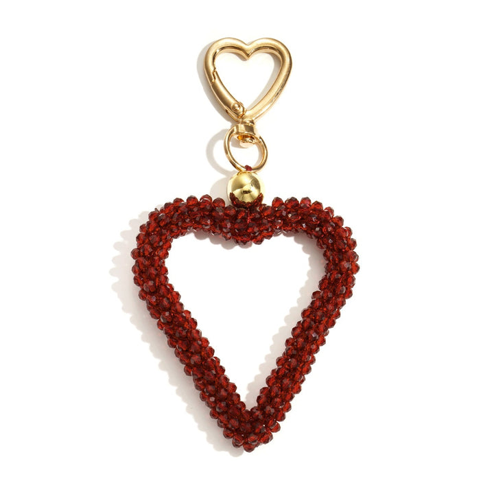 Kristall Herz Taschenanhänger in prupur mit Karabiner, Produktfoto vor weißem Hintergrund.