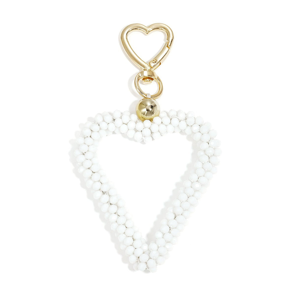 Kristall Herz Taschenanhänger in weiss mit Karabiner, Produktfoto vor weißem Hintergrund.