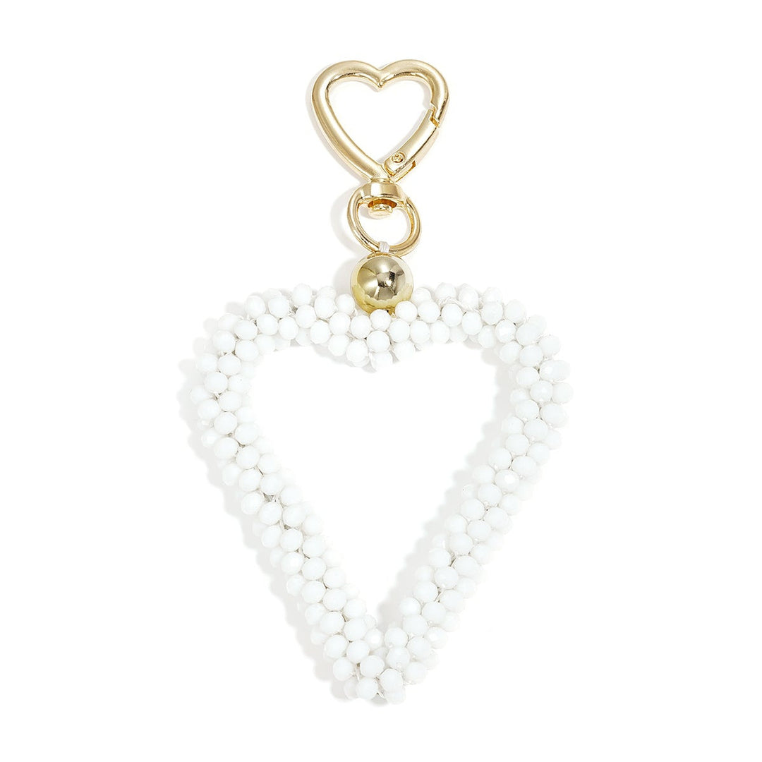 Kristall Herz Taschenanhänger in weiss mit Karabiner, Produktfoto vor weißem Hintergrund.
