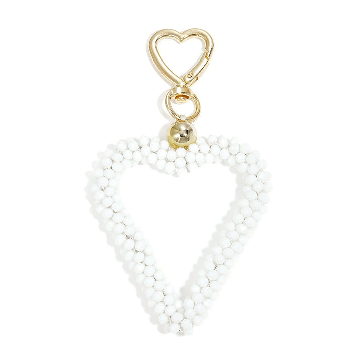 Kristall Herz Taschenanhänger in weiss mit Karabiner, Produktfoto vor weißem Hintergrund.